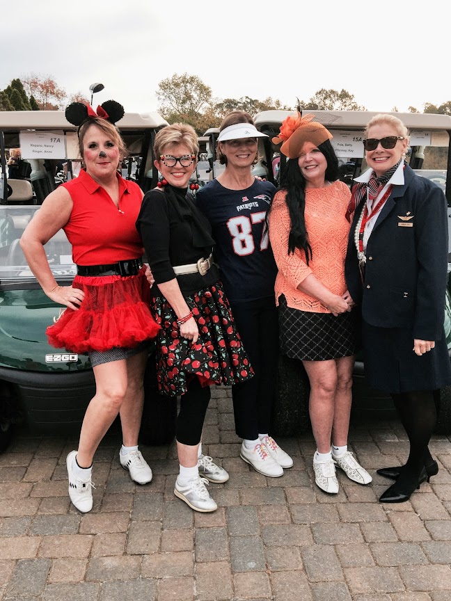 Robin LaMonte playing golf on Halloween with friends