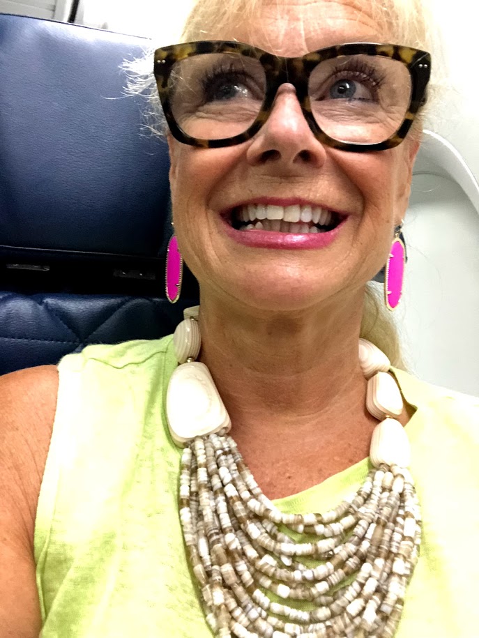 Robin is wearing J Jill and Kendra Scott earrings