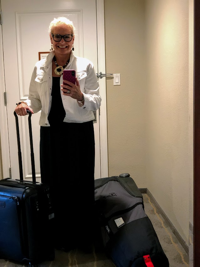 White denim jacket over a maxi dress