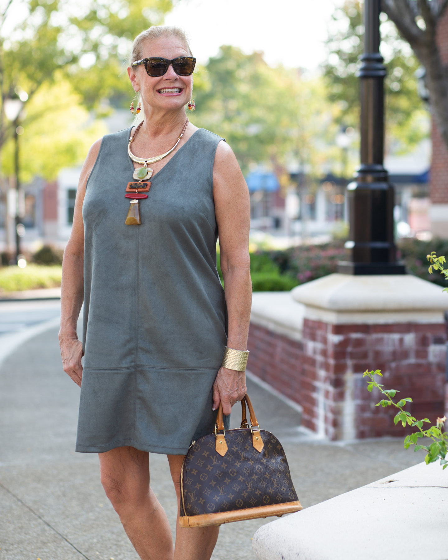 Robin is wearing faux suede jumper from Peach with statement necklace