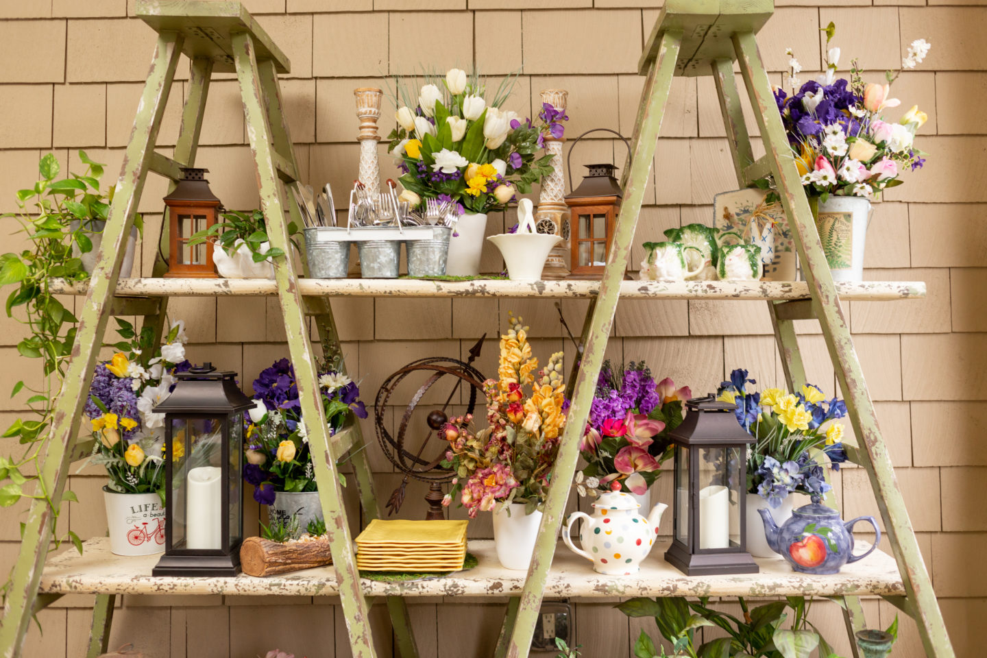 Cottage ladder bookcase filled with flowers