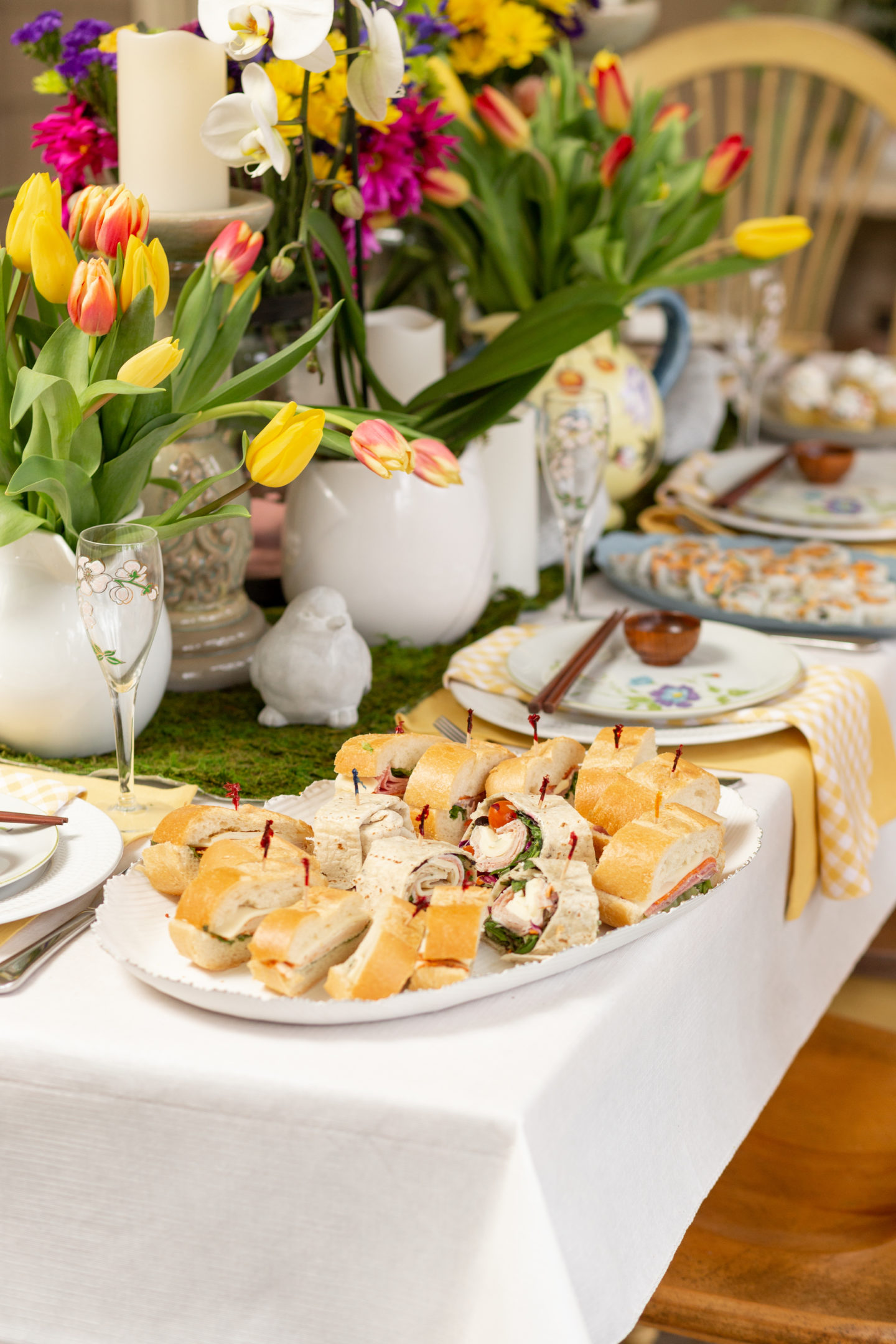 Adding a variety of heights to your flowers and candles also make for a visually appealing centerpiece.