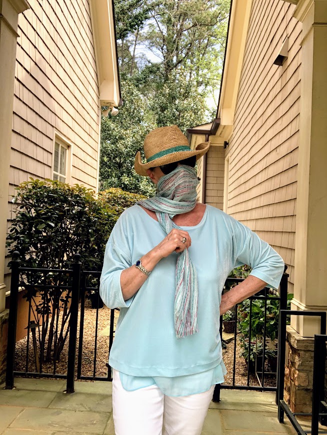 Robin is wearing a scarf that she wears to cover her face when shopping to protect herself against the coronavirus