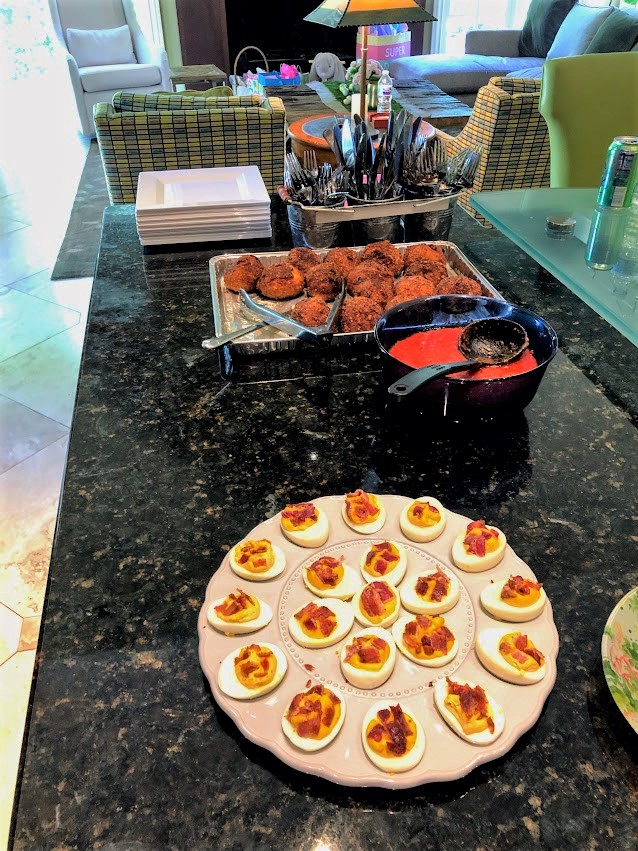 Italian Arancini rice balls, sauce, and deviled eggs are appetizers for Easter.