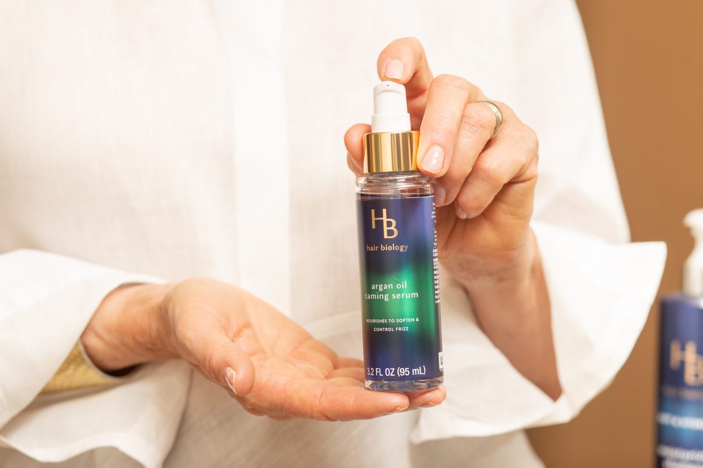 After I shampoo and condition my hair I use the Argan Oil Taming Serum from Hair Biology before I blow dry my hair.