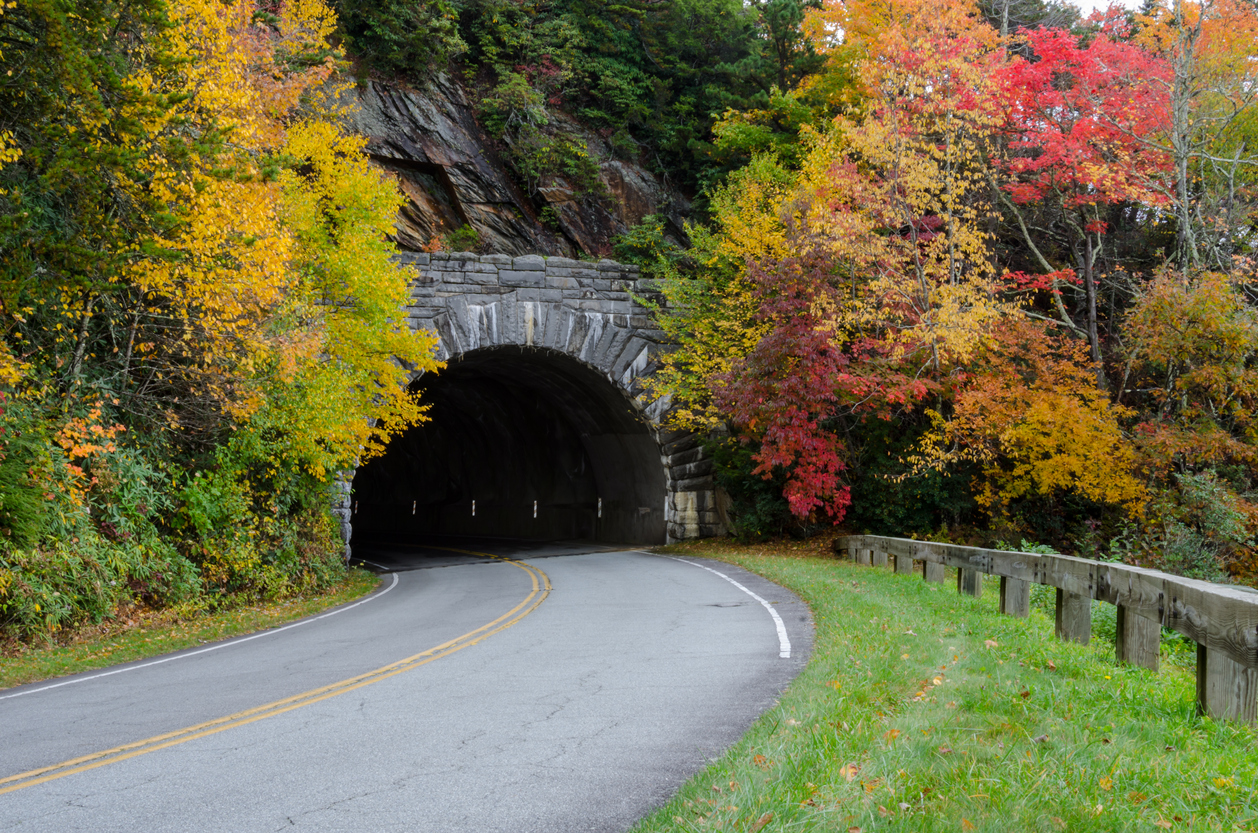 Leaves change around a stone tunnel on the Blue Ridge Parkway