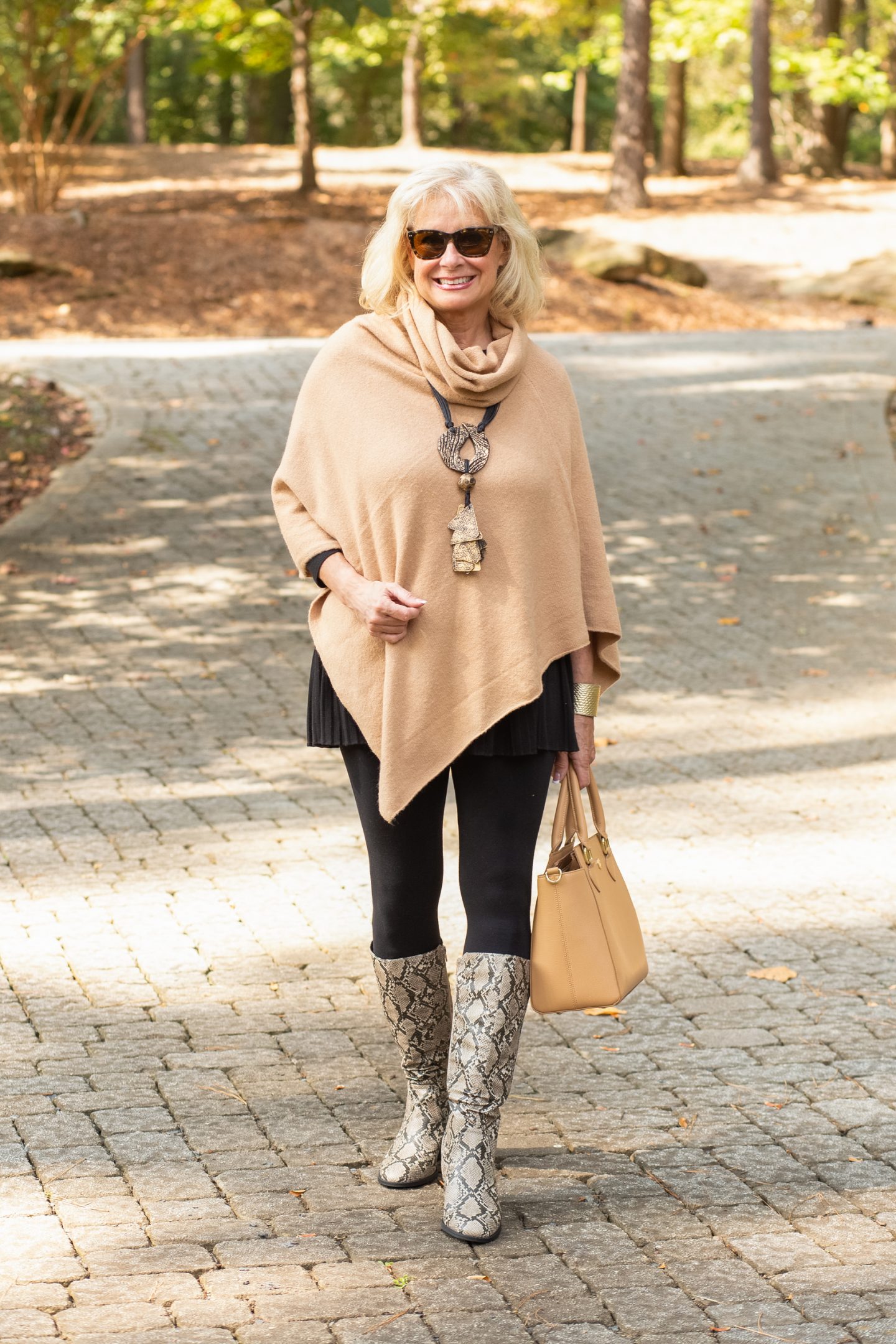 There are so many ways to style snake print boots but for me throwing on a cashmere poncho over a tunic and some leggings is such an effortless look.