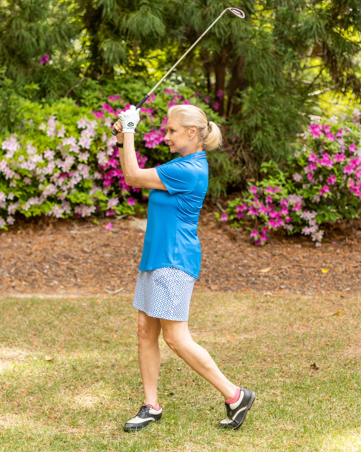 Wearing Performance polo shirt and Mina skort from Jofit's Rojito Collection