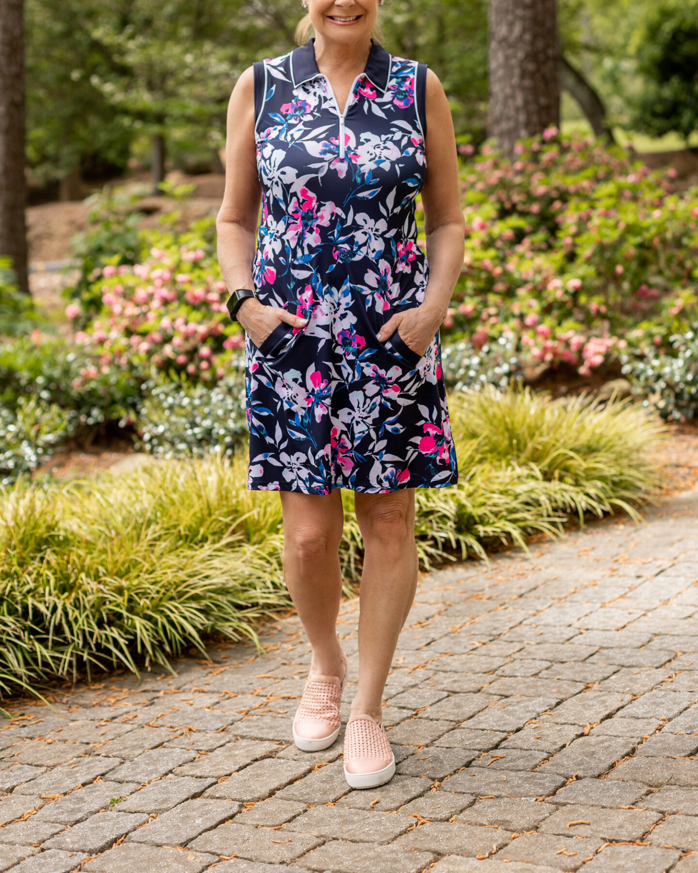 Wearing sleeveless polo dress from Jofit's Rojito Collection and Jambu's Erin Too sneakers