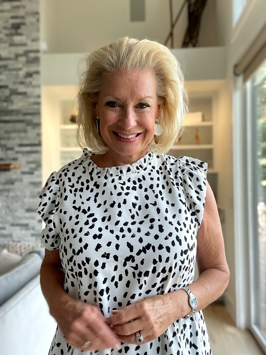 Wearing a Dalmatian print ruffled top
