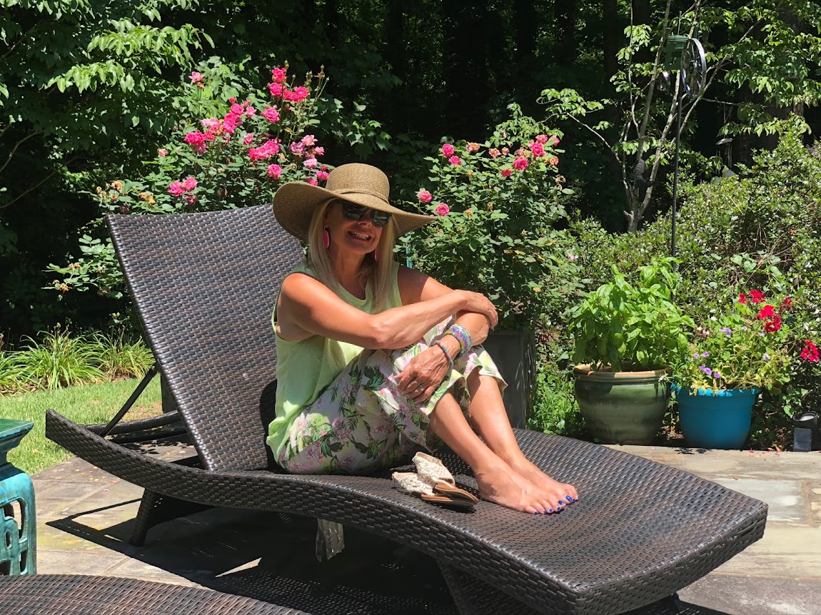 Sitting next to my basil pot in my flower garden.