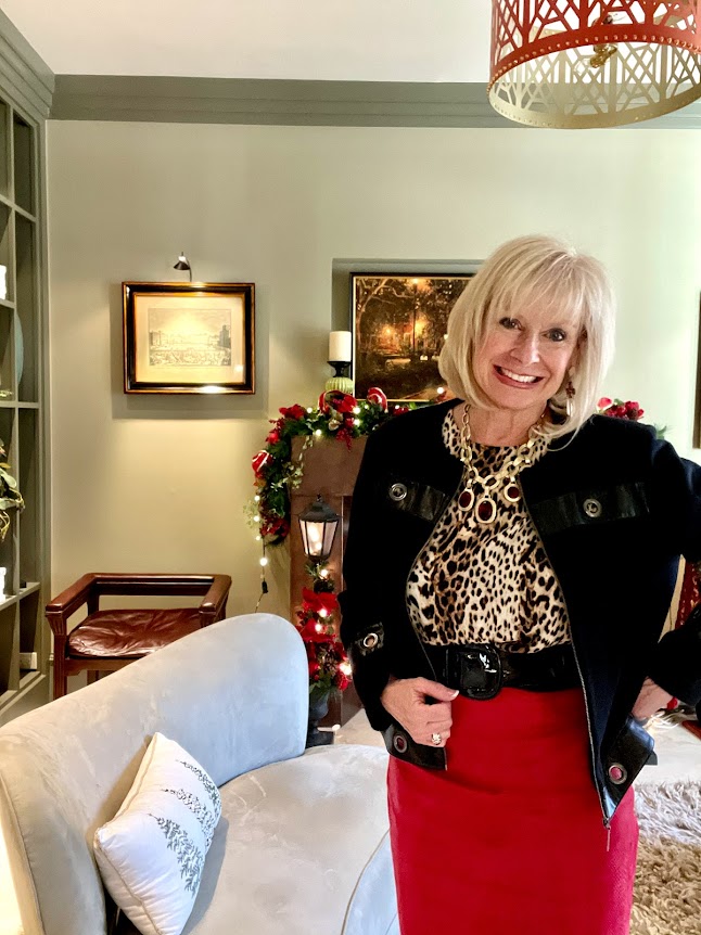 wearing a red leather skirt and a leopard print top for my holiday style.