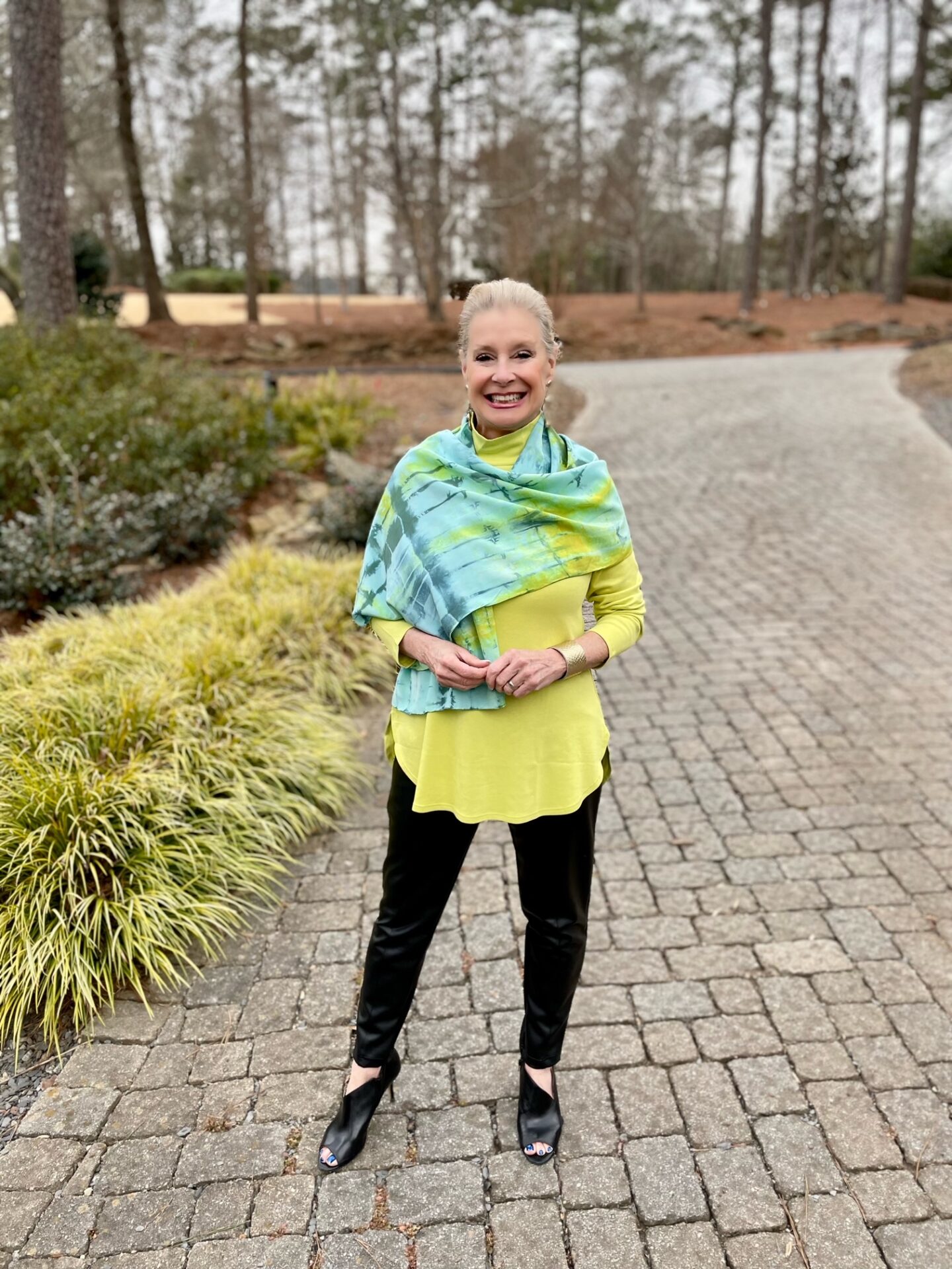 wearing a tie-dyed blue silk scarf over a citrine colored tunic adds an extra color element