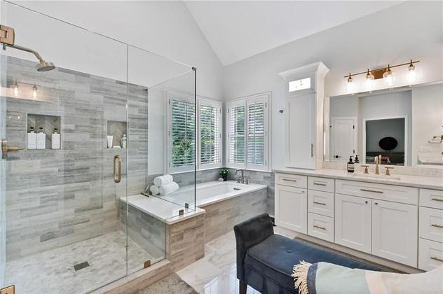 Bathroom designed by Robin LaMonte featuring a large shower with a sitting area