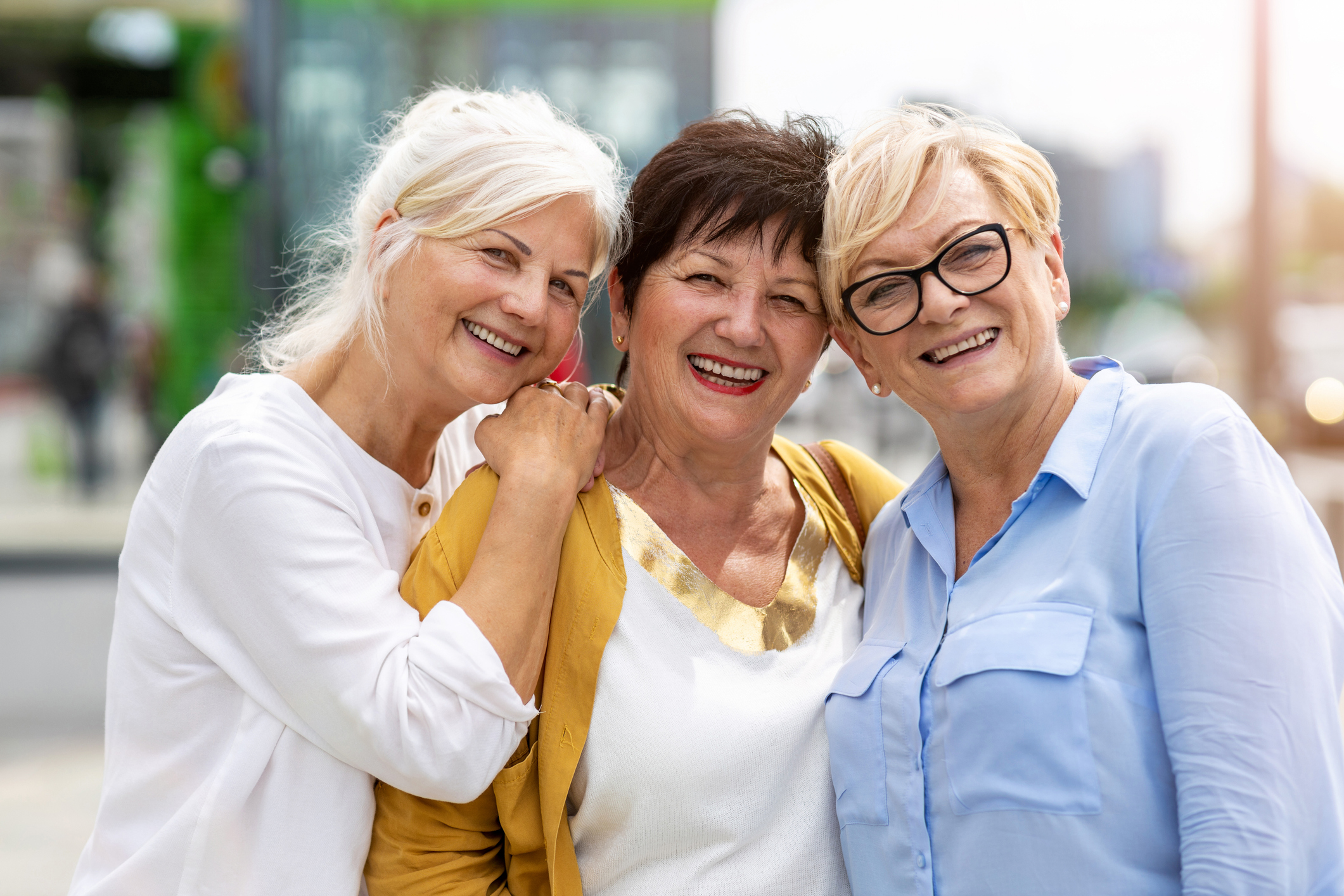 Three senior female friends having good time together
