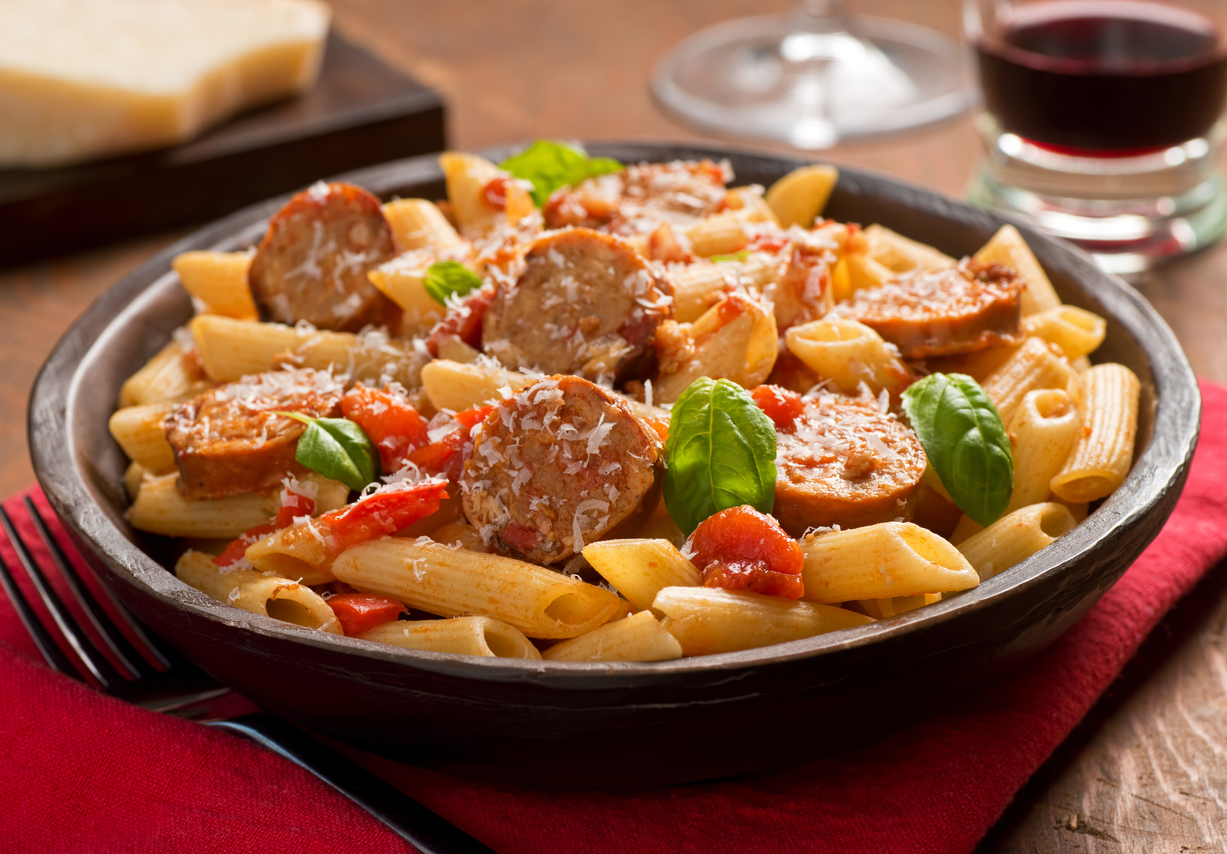 Italian style pasta with penne, spicy sausage, red peppers, and tomato sauce with freshly grated parmesan cheese.