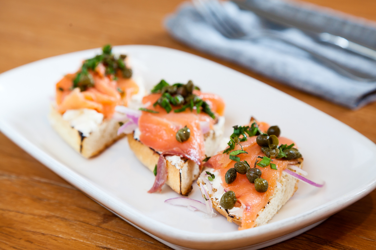 Smoked salmon, capers, onions, and cream cheese on toast.
