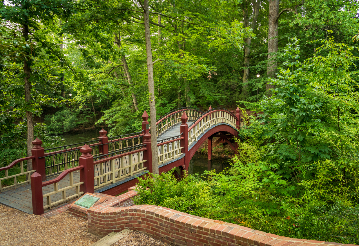 The ornate wooden bridge over Crim Dell on campus of William and Mary College in Williamsburg Virginia